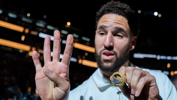 October 18, 2022; San Francisco, California, USA; Golden State Warriors guard Klay Thompson (11) shows his championship ring before the game against the Los Angeles Lakers at Chase Center. Mandatory Credit: Kyle Terada-Imagn Images