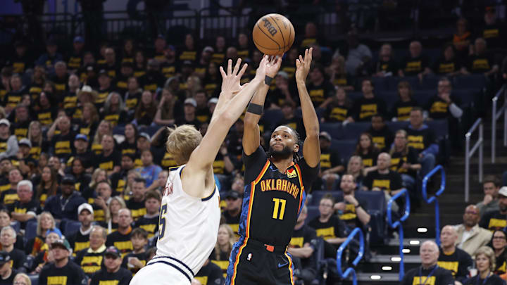 May 7, 2025; Oklahoma City, Oklahoma, USA; Oklahoma City Thunder guard Isaiah Joe (11) shoots a three point basket over Denver Nuggets forward Hunter Tyson (5) in the second half during game two of the second round for the 2025 NBA Playoffs at Paycom Center. Mandatory Credit: Alonzo Adams-Imagn Images
