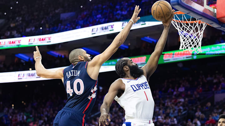 Mar 27, 2024; Philadelphia, Pennsylvania, USA; LA Clippers guard James Harden (1) drives for a shot past Philadelphia 76ers forward Nicolas Batum (40) during the fourth quarter at Wells Fargo Center. Mandatory Credit: Bill Streicher-USA TODAY Sports