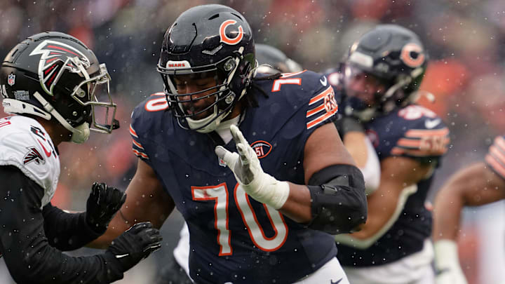 Dec 31, 2023; Chicago, Illinois, USA;  Chicago Bears offensive lineman Braxton Jones (70) blocks against the Atlanta Falcons at Soldier Field. Mandatory Credit: Jamie Sabau-Imagn Images