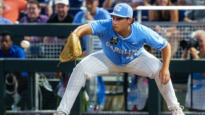 Jun 12, 2026; Omaha, NE, USA; North Carolina Tar Heels first baseman Erik Paulsen (44) gets an out at first on a double play against the Mississippi Rebels during the ninth inning at Charles Schwab Field. Mandatory Credit: Dylan Widger-Imagn Images Jun 12, 2026; Omaha, NE, USA; North Carolina Tar Heels first baseman Erik Paulsen (44) gets an out at first on a double play against the Mississippi Rebels during the ninth inning at Charles Schwab Field. Mandatory Credit: Dylan Widger-Imagn Images