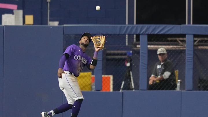 Jul 21, 2023; Miami, Florida, USA; Colorado Rockies left fielder Jurickson Profar (29) catches a fly ball in the eight inning against the Miami Marlins at loanDepot Park. Mandatory Credit: Jim Rassol-Imagn Images Jul 21, 2023; Miami, Florida, USA; Colorado Rockies left fielder Jurickson Profar (29) catches a fly ball in the eight inning against the Miami Marlins at loanDepot Park. Mandatory Credit: Jim Rassol-Imagn Images