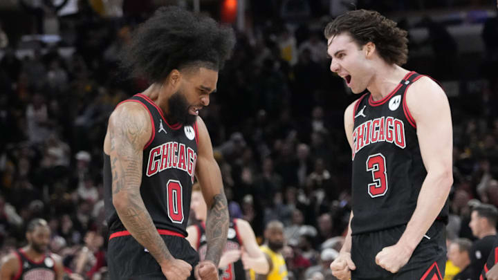 Mar 27, 2025; Chicago, Illinois, USA; Chicago Bulls guard Coby White (0) celebrates his three point basket against the Los Angeles Lakers with guard Josh Giddey (3) during the second half at United Center. Mandatory Credit: David Banks-Imagn Images