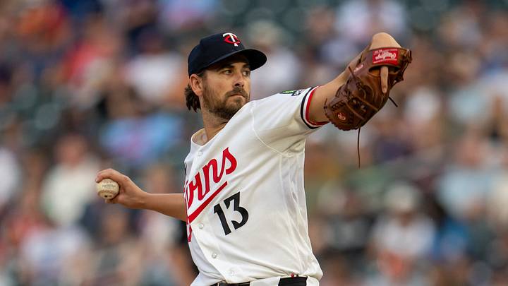 Aug 28, 2026; Minneapolis, Minnesota, USA;  Minnesota Twins pitcher Dean Kremer (13) delivers a pitch against the Chicago White Sox in the first inning at Target Field.  Mandatory Credit: Jesse Johnson-Imagn Images