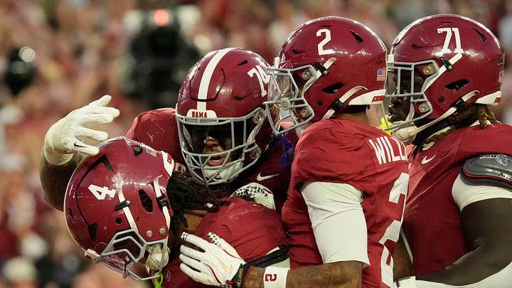 Nov 15, 2025; Tuscaloosa, Alabama, USA;  Alabama Crimson Tide running back Daniel Hill (4) celebrates his touchdown run against the Oklahoma Sooners with offensive lineman Kadyn Proctor (74), wide receiver Ryan Williams (2) and offensive lineman Kam Dewberry (71) at Saban Field at Bryant-Denny Stadium. Oklahoma defeated Alabama 23-21. Mandatory Credit: Gary Cosby Jr.-Imagn Images
