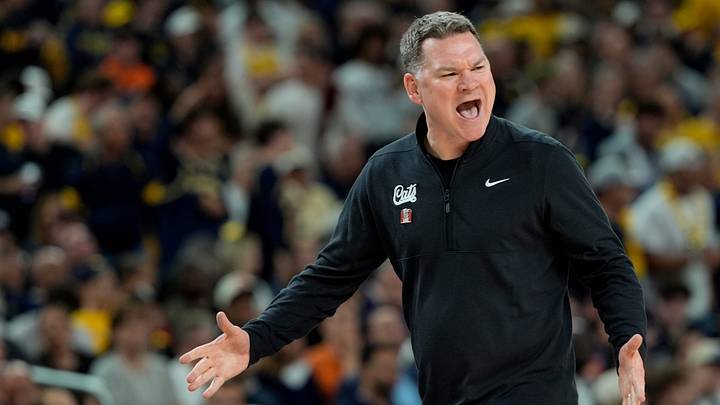 Arizona head coach Tommy Lloyd shouts toward the court in the first half of their Final Four game against Michigan at Lucas Oil Stadium in Indianapolis on Saturday, April 4, 2026.