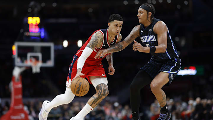 Washington Wizards forward Kyle Kuzma (33) drives to the basket as Orlando Magic forward Paolo Banchero (5) defends in the second half at Capital One Arena.