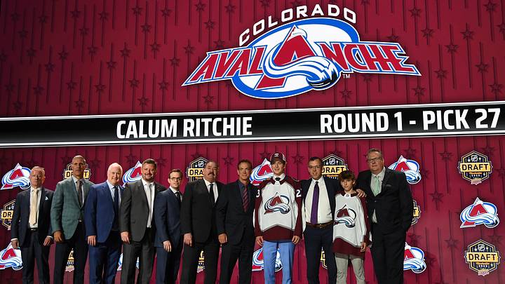 Jun 28, 2023; Nashville, Tennessee, USA; Colorado Avalanche draft pick Calum Ritchie stands with Ava staff after being selected with the thirty first pick in round one of the 2023 NHL Draft at Bridgestone Arena. Mandatory Credit: Christopher Hanewinckel-Imagn Images