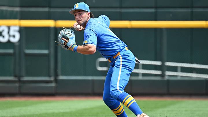 Jun 14, 2025; Omaha, Neb, USA;  UCLA Bruins shortstop Roch Cholowsky (1) completes a double play against the Murray State Racers during the second inning at Charles Schwab Field. Mandatory Credit: Steven Branscombe-Imagn Images