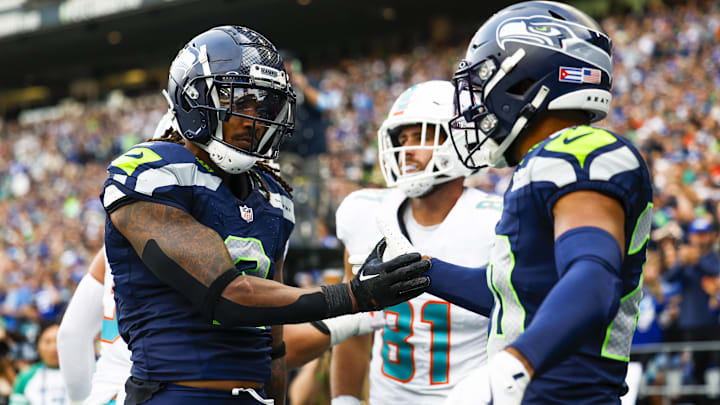 Sep 22, 2024; Seattle, Washington, USA; Seattle Seahawks safety Rayshawn Jenkins (2) celebrates with safety Julian Love (20) an incomplete pass to Miami Dolphins tight end Durham Smythe (81) during the fourth quarter at Lumen Field. Mandatory Credit: Joe Nicholson-Imagn Images