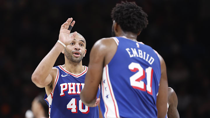 Nov 25, 2023; Oklahoma City, Oklahoma, USA; Philadelphia 76ers forward Nicolas Batum (40) talks to center Joel Embiid (21) during the second half against the Oklahoma City Thunder at Paycom Center. Mandatory Credit: Alonzo Adams-Imagn Images