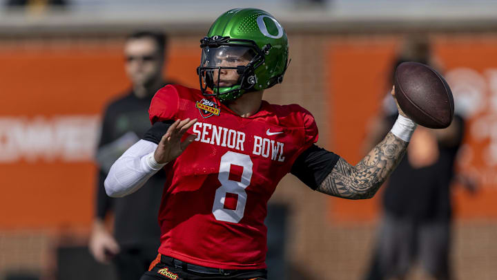 Jan 28, 2025; Mobile, AL, USA; National team quarterback Dillon Gabriel of Oregon (8) throws the ball during Senior Bowl practice for the National team at Hancock Whitney Stadium. Mandatory Credit: Vasha Hunt-Imagn Images