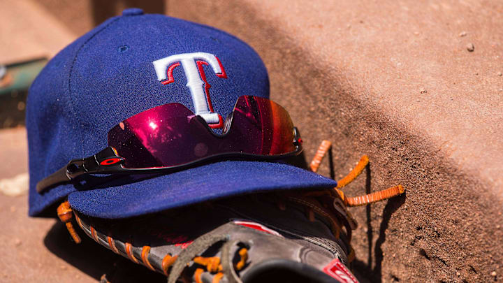 Jun 13, 2015; Arlington, TX, USA; A view a Texas Rangers baseball hat and glove during the game between the Texas Rangers and the Minnesota Twins at Globe Life Park in Arlington. The Rangers defeated the Twins 11-7. 