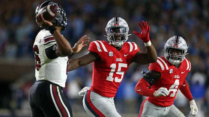 Nov 1, 2025; Oxford, Mississippi, USA; Mississippi Rebels defensive lineman Da'Shawn Womack (15) and Mississippi Rebels linebacker Suntarine Perkins (4) rush South Carolina Gamecocks quarterback LaNorris Sellers (16) during the fourth quarter at Vaught-Hemingway Stadium. Mandatory Credit: Petre Thomas-Imagn Images