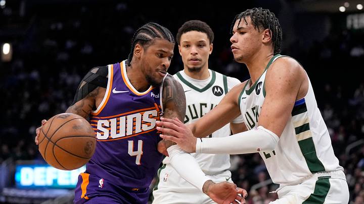 Mar 10, 2026; Milwaukee, Wisconsin, USA; Phoenix Suns guard Jalen Green (4) drives for the basket against Milwaukee Bucks forward Ousmane Dieng (21) during the fourth quarter at Fiserv Forum. Mandatory Credit: Jeff Hanisch-Imagn Images Mar 10, 2026; Milwaukee, Wisconsin, USA; Phoenix Suns guard Jalen Green (4) drives for the basket against Milwaukee Bucks forward Ousmane Dieng (21) during the fourth quarter at Fiserv Forum. Mandatory Credit: Jeff Hanisch-Imagn Images