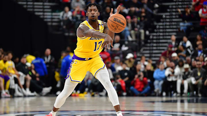 Feb 4, 2025; Inglewood, California, USA; Los Angeles Lakers forward Dorian Finney-Smith (17) passes the ball against the Los Angeles Clippers during the second half at Intuit Dome. Mandatory Credit: Gary A. Vasquez-Imagn Images