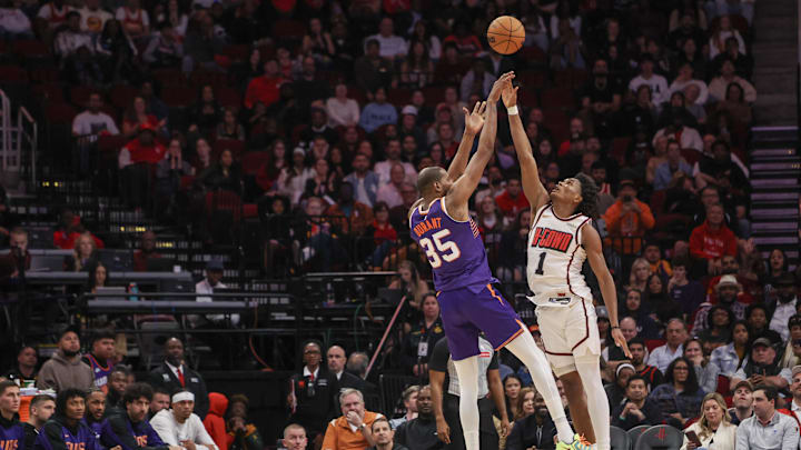 Feb 12, 2025; Houston, Texas, USA; Phoenix Suns forward Kevin Durant (35) makes a three point basket against Houston Rockets forward Amen Thompson (1) in the second half at Toyota Center. Mandatory Credit: Thomas Shea-Imagn Images
