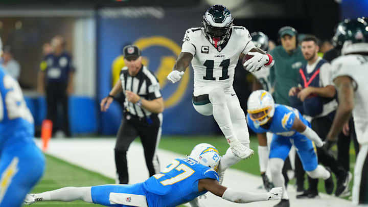 Dec 8, 2025; Inglewood, California, USA;  Philadelphia Eagles wide receiver A.J. Brown (11) runs against Los Angeles Chargers safety RJ Mickens (27) in the second half at SoFi Stadium. Mandatory Credit: Kirby Lee-Imagn Images