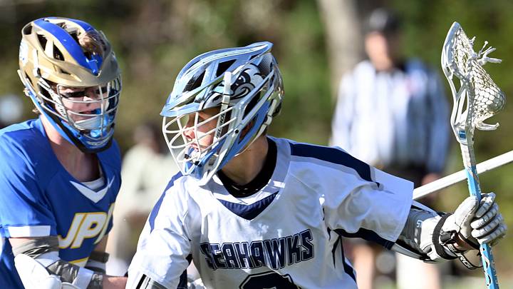 Landen O'Neil of Cape Cod Academy moves on Jamie Erikson of St. John Paul II 