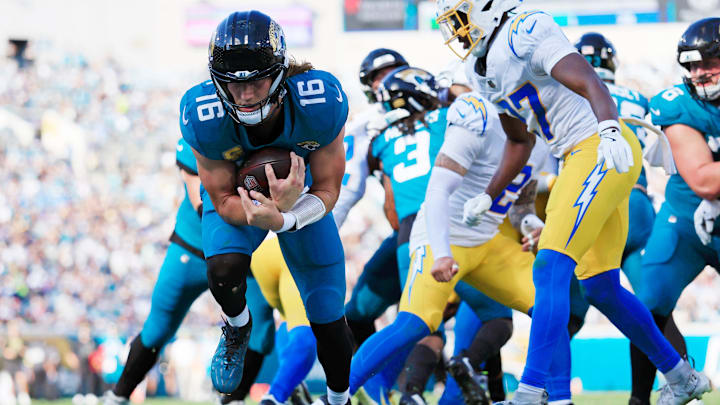 Jacksonville Jaguars quarterback Trevor Lawrence (16) scores a touchdown during the third quarter of an NFL football game at EverBank Stadium, Sunday, Nov. 16, 2025 in Jacksonville, Fla. The Jacksonville Jaguars defeated the Los Angeles Chargers 35-6. [Corey Perrine/Florida Times-Union]