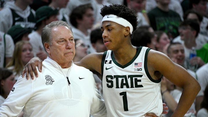 Mar 9, 2025; East Lansing, Michigan, USA;  Michigan State Spartans head coach Tom Izzo huddles with Michigan State Spartans guard Jeremy Fears Jr. (1) during the second half against the Michigan Wolverines at Jack Breslin Student Events Center. Mandatory Credit: Dale Young-Imagn Images