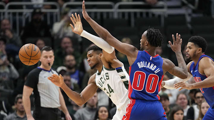 Nov 13, 2024; Milwaukee, Wisconsin, USA;  Detroit Pistons forward Ron Holland II (00) knocks the ball away from Milwaukee Bucks forward Giannis Antetokounmpo (34) during the third quarter at Fiserv Forum. Mandatory Credit: Jeff Hanisch-Imagn Images