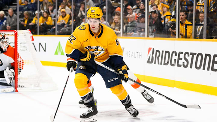 Nov 27, 2024; Nashville, Tennessee, USA; Nashville Predators center Tommy Novak (82) skates behind the net against the Philadelphia Flyers during the third period at Bridgestone Arena. Mandatory Credit: Steve Roberts-Imagn Images Nov 27, 2024; Nashville, Tennessee, USA; Nashville Predators center Tommy Novak (82) skates behind the net against the Philadelphia Flyers during the third period at Bridgestone Arena. Mandatory Credit: Steve Roberts-Imagn Images
