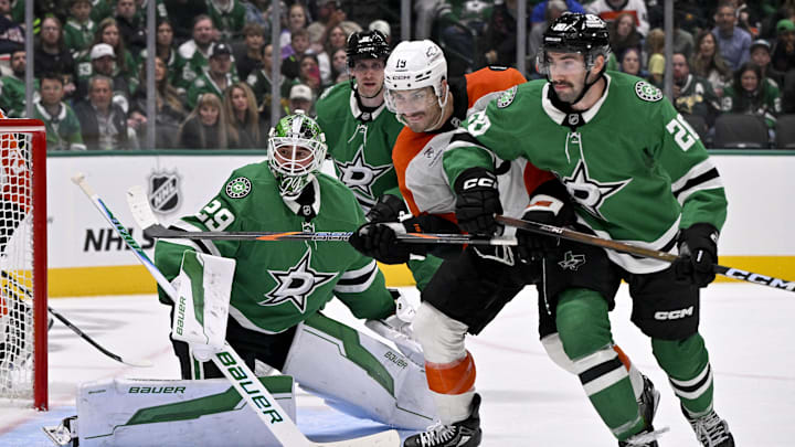 Nov 15, 2025; Dallas, Texas, USA; Philadelphia Flyers right wing Garnet Hathaway (19) and Dallas Stars defenseman Kyle Capobianco (20) and goaltender Jake Oettinger (29) look for the puck during the third period at the American Airlines Center. Mandatory Credit: Jerome Miron-Imagn Images Nov 15, 2025; Dallas, Texas, USA; Philadelphia Flyers right wing Garnet Hathaway (19) and Dallas Stars defenseman Kyle Capobianco (20) and goaltender Jake Oettinger (29) look for the puck during the third period at the American Airlines Center. Mandatory Credit: Jerome Miron-Imagn Images