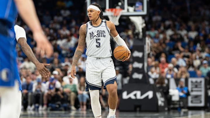 Orlando Magic forward Paolo Banchero (5) dribbles the ball against the Dallas Mavericks in the fourth quarter at Kia Center.