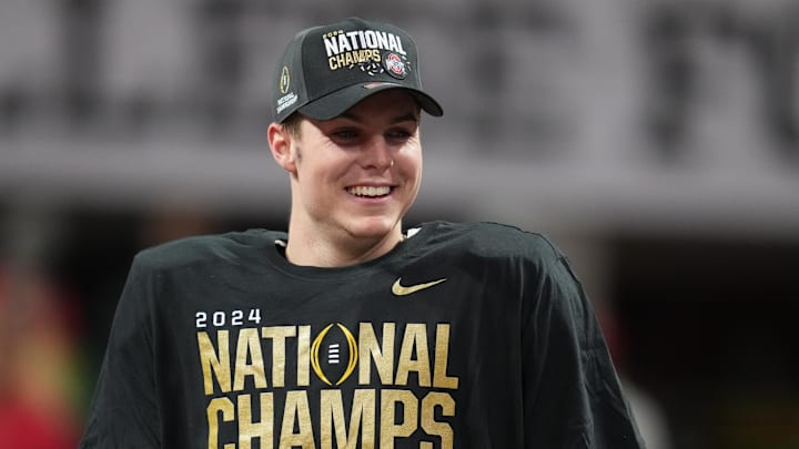 Jan 20, 2025; Atlanta, GA, USA; Ohio State Buckeyes quarterback Will Howard (18) on the podium after defeating the Notre Dame Fighting Irish in the CFP National Championship college football game at Mercedes-Benz Stadium. Mandatory Credit: Kirby Lee-Imagn Images Jan 20, 2025; Atlanta, GA, USA; Ohio State Buckeyes quarterback Will Howard (18) on the podium after defeating the Notre Dame Fighting Irish in the CFP National Championship college football game at Mercedes-Benz Stadium. Mandatory Credit: Kirby Lee-Imagn Images