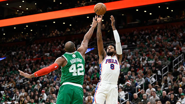 Dec 25, 2024; Boston, Massachusetts, USA; Philadelphia 76ers forward Paul George (8) shoots the ball over Boston Celtics center Al Horford (42) during the first half at TD Garden. Mandatory Credit: Eric Canha-Imagn Images