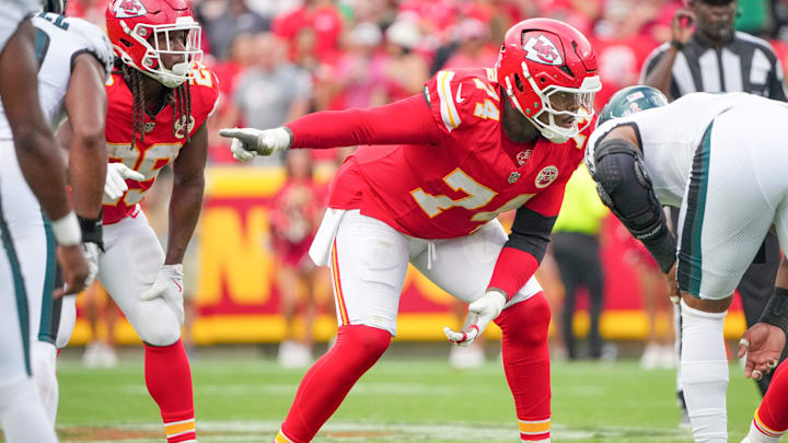 Kansas City Chiefs offensive tackle Jawaan Taylor (74) gestures at the line of scrimmage Kansas City Chiefs offensive tackle Jawaan Taylor (74) gestures at the line of scrimmage