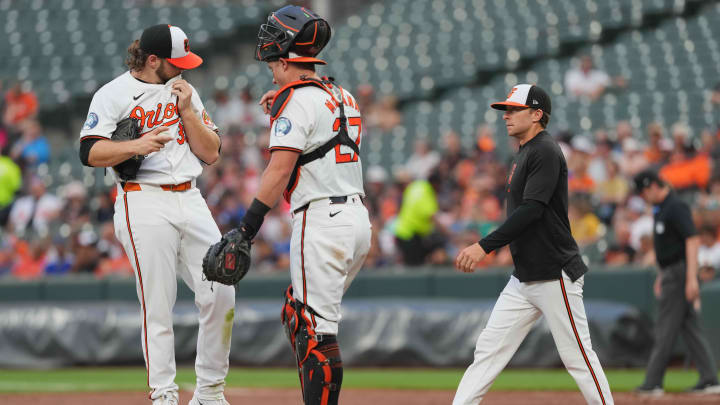 Jul 10, 2024; Baltimore, Maryland, USA; Baltimore Orioles pitcher Corbin Burnes (39) is joined by catcher James McCann (center) and pitching coach Drew French (right) during the second inning against the Chicago Cubs at Oriole Park at Camden Yards Jul 10, 2024; Baltimore, Maryland, USA; Baltimore Orioles pitcher Corbin Burnes (39) is joined by catcher James McCann (center) and pitching coach Drew French (right) during the second inning against the Chicago Cubs at Oriole Park at Camden Yards
