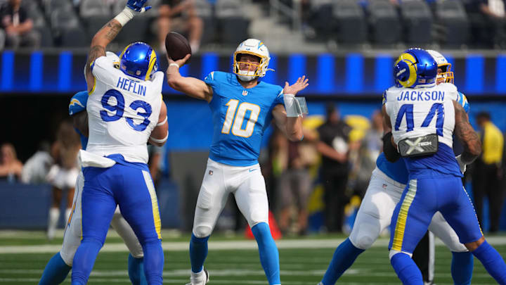 Aug 16, 2025; Inglewood, California, USA; Los Angeles Chargers quarterback Justin Herbert (10) throws the ball against the Los Angeles Rams in the first half at SoFi Stadium. Mandatory Credit: Kirby Lee-Imagn Images