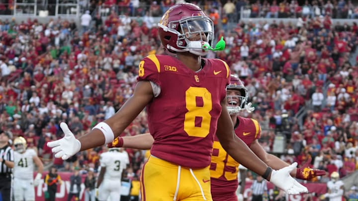 Nov 30, 2024; Los Angeles, California, USA; Southern California Trojans wide receiver Ja'Kobi Lane (8) celebrates after scoring on a 6-yard touchdown reception against the Notre Dame Fighting Irish in the second half at United Airlines Field at Los Angeles Memorial Coliseum. Mandatory Credit: Kirby Lee-Imagn Images