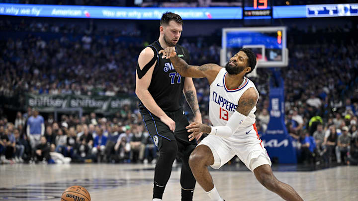 May 3, 2024; Dallas, Texas, USA; LA Clippers forward Paul George (13) is fouled by Dallas Mavericks