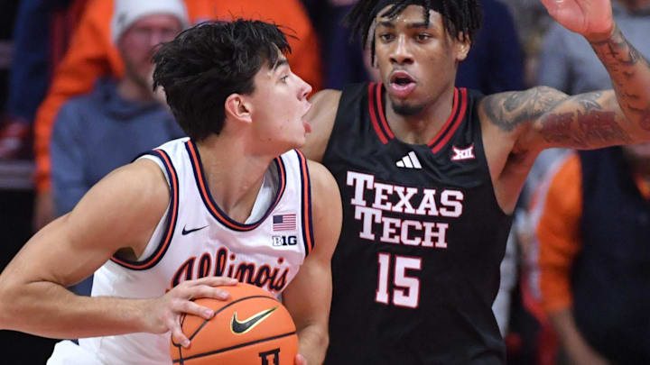 Nov 11, 2025; Champaign, Illinois, USA; Texas Tech Red Raiders forward JT Toppin (15) defends against Illinois Fighting Illini guard Andrej Stojakovic (2) during the second half at State Farm Center. Mandatory Credit: Ron Johnson-Imagn Images