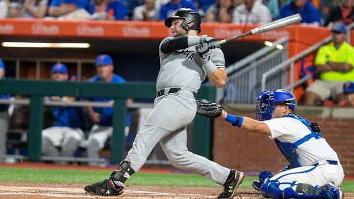 Gamecocks catcher Cole Messina (19) with a base hit in the top of the first inning in Game 1 of NCAA