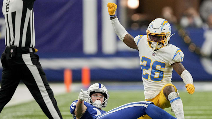 Dec 26, 2022; Indianapolis, Indiana, USA; Indianapolis Colts wide receiver Alec Pierce (14) and Los Angeles Chargers cornerback Asante Samuel Jr. (26) signal to the official Monday, Dec. 26, 2022, during a game against the Los Angeles Chargers at Lucas Oil Stadium in Indianapolis. Mandatory Credit: Robert Scheer-Imagn Images