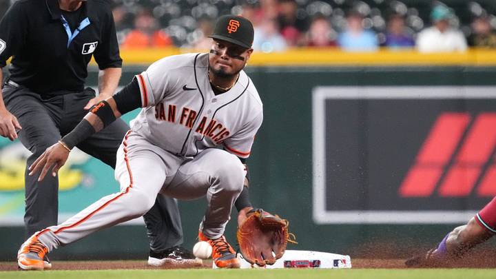 Arizona Diamondbacks baserunner Ketel Marte (4) slides in safely on a steal past San Francisco Giants Luis Arraez (1) at Chase Field in Phoenix, on July 1, 2026. Arizona Diamondbacks baserunner Ketel Marte (4) slides in safely on a steal past San Francisco Giants Luis Arraez (1) at Chase Field in Phoenix, on July 1, 2026.