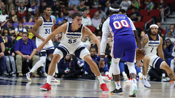 Oct 11, 2024; Des Moines, Iowa, USA; Minnesota Timberwolves center Luka Garza (55) defends Philadelphia 76ers guard Reggie Jackson (00) at Wells Fargo Arena. The Timberwolves beat the 76ers 121 to 111. Mandatory Credit: Reese Strickland-Imagn Images Oct 11, 2024; Des Moines, Iowa, USA; Minnesota Timberwolves center Luka Garza (55) defends Philadelphia 76ers guard Reggie Jackson (00) at Wells Fargo Arena. The Timberwolves beat the 76ers 121 to 111. Mandatory Credit: Reese Strickland-Imagn Images