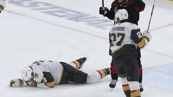 Jun 4, 2026; Raleigh, North Carolina, USA; Vegas Golden Knights defenseman Brayden McNabb (3) reacts to a puck to the face defend against Carolina Hurricanes left wing Eric Robinson (50) during the first period in game two of the 2026 Stanley Cup Final at Lenovo Center. Mandatory Credit: Nathan Ray Seebeck-Imagn Images