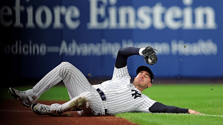 Oct 8, 2025; Bronx, New York, USA; New York Yankees left fielder Cody Bellinger (35) slides to makes a catch during the first inning against the Toronto Blue Jays during game four of the ALDS round for the 2025 MLB playoffs at Yankee Stadium. Mandatory Credit: Brad Penner-Imagn Images Oct 8, 2025; Bronx, New York, USA; New York Yankees left fielder Cody Bellinger (35) slides to makes a catch during the first inning against the Toronto Blue Jays during game four of the ALDS round for the 2025 MLB playoffs at Yankee Stadium. Mandatory Credit: Brad Penner-Imagn Images
