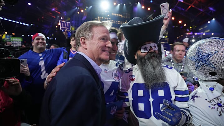 NFL commissioner Roger Goodell poses with fans during the 2024 NFL Draft.