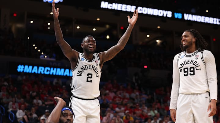 Mar 19, 2026; Oklahoma City, OK, USA; Vanderbilt Commodores guard Duke Miles (2) and forward Devin McGlockton (99) react during the first half against the McNeese Cowboys during a first round game of the men's 2026 NCAA Tournament at Paycom Center. Mandatory Credit: William Purnell-Imagn Images