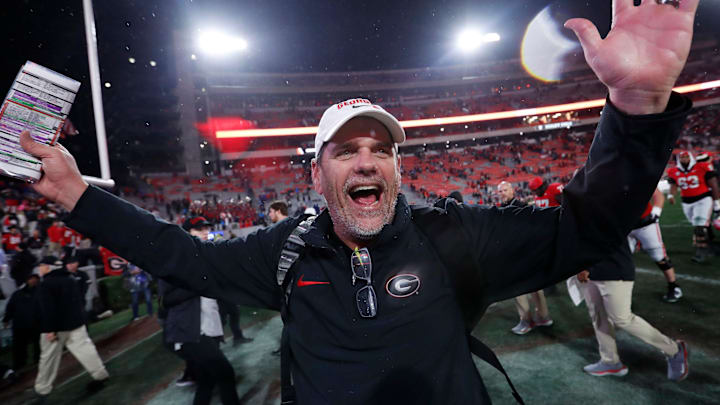 Georgia Offensive Coordinator Mike Bobo celebrates after wining a NCAA college football game against Ole Miss in Athens, Ga., on Saturday, Nov. 11, 2023. Georgia won 52-17. Georgia Offensive Coordinator Mike Bobo celebrates after wining a NCAA college football game against Ole Miss in Athens, Ga., on Saturday, Nov. 11, 2023. Georgia won 52-17.