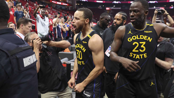 Golden State Warriors guard Stephen Curry (30) and forward Draymond Green (23) walk off the court after game seven of the first round for the 2025 NBA Playoffs against the Houston Rockets at Toyota Center. Mandatory Credit: Troy Taormina-Imagn Images