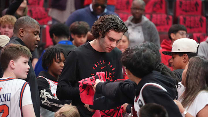 Apr 16, 2025; Chicago, Illinois, USA; Chicago Bulls guard Josh Giddey (3) signs autographs before the game against the Miami Heat at United Center. Mandatory Credit: David Banks-Imagn Images