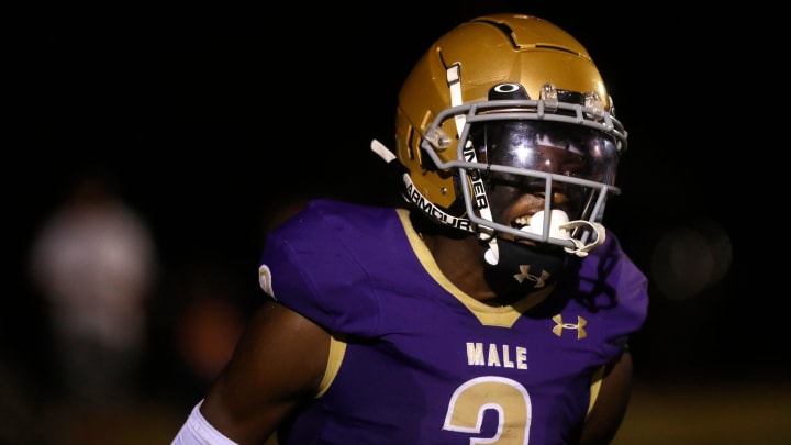 Male's Antonio Harris celebrates scoring a touchdown against Indianapolis Roncalli Friday night.