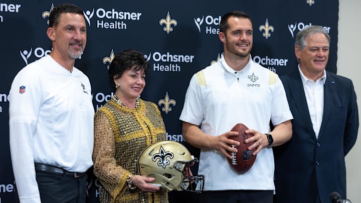 Mar 11, 2023; Metairie, LA, USA; New Orleans Saints head coach Dennis Allen and chief executive officer Gayle Benson and quarterback Derek Carr and general manager Mickey Loomis pose at Ochsner Sports Performance Center. Mandatory Credit: Stephen Lew-Imagn Images Mar 11, 2023; Metairie, LA, USA; New Orleans Saints head coach Dennis Allen and chief executive officer Gayle Benson and quarterback Derek Carr and general manager Mickey Loomis pose at Ochsner Sports Performance Center. Mandatory Credit: Stephen Lew-Imagn Images